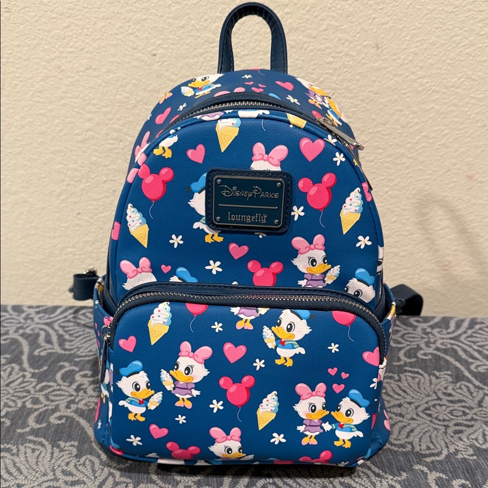 Like New Loungefly Disney Parks Donald Duck and Daisy Backpack.